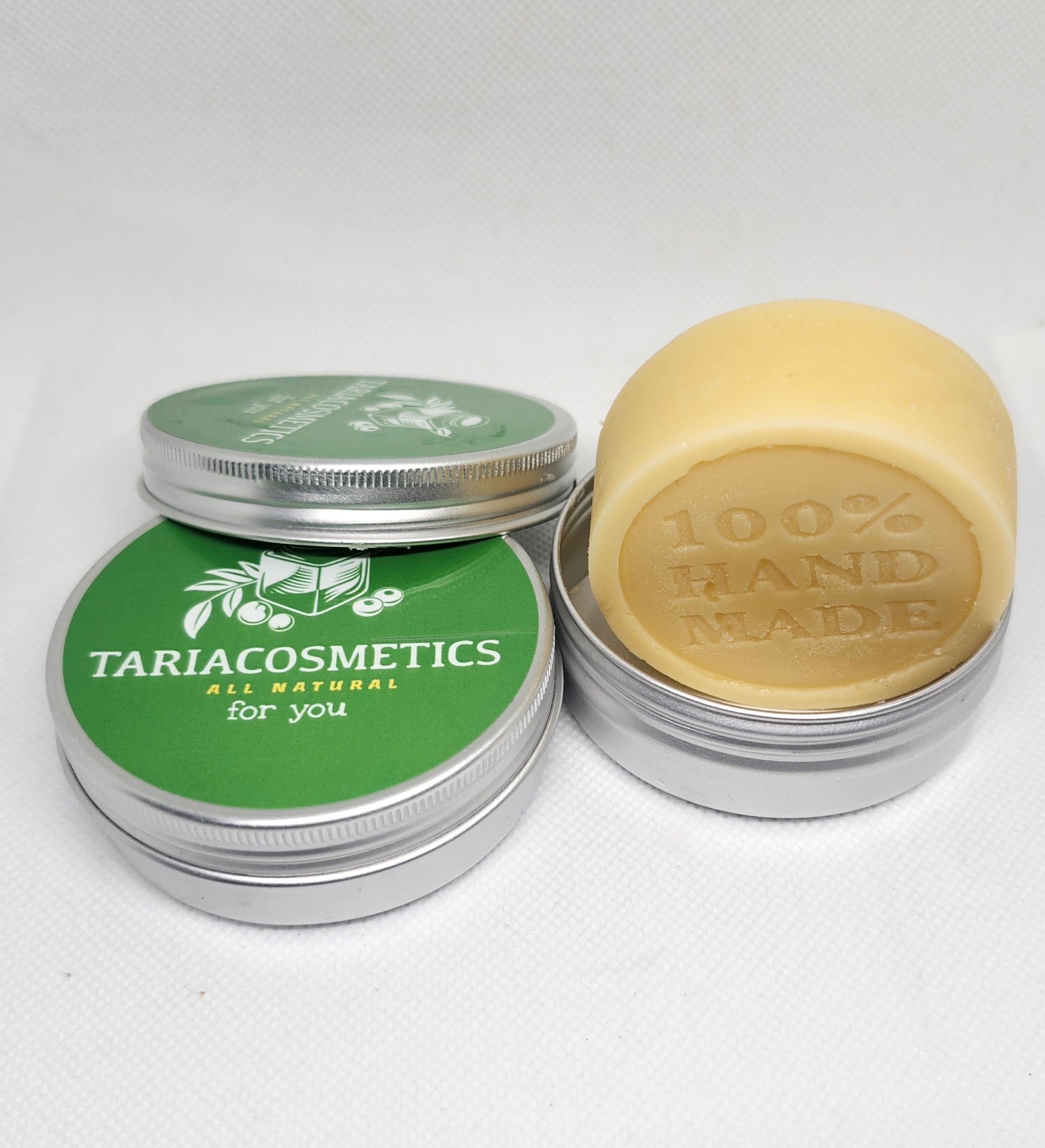 Top-down view of an aluminum tin with a green circular label reading 