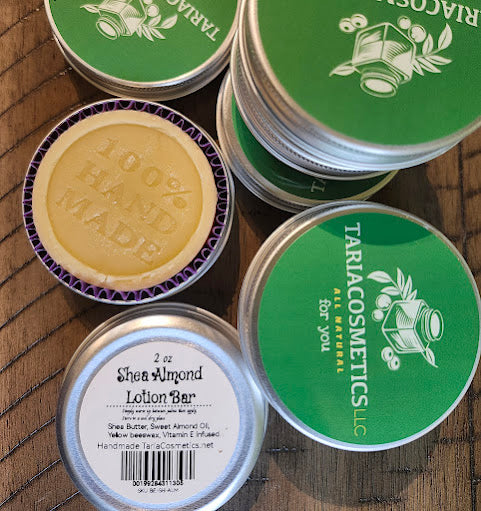 TariaCosmetics lotion bars and containers on a wooden surface