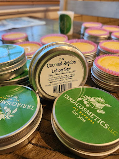 Tariaco Cosmetics lotion bars on a wooden surface