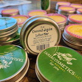 Tariaco Cosmetics lotion bars on a wooden surface