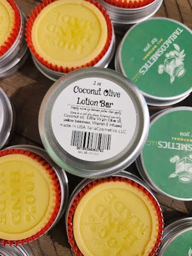 Collection of coconut olive lotion bars with visible branding on tins.