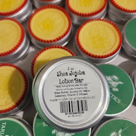 Shea Jojoba Lotion Bars with visible branding on a white background