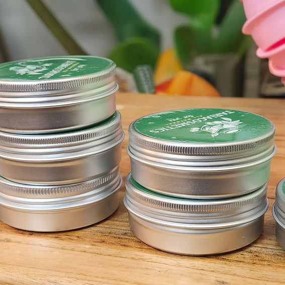 Four rows of lotion bar cans next to each other with rows starting from one bar to four bars in increment